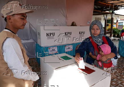 Voters cast their ballows in regional government elections in Indonesia