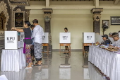 Voters cast their ballots in regional government elections in Indonesia