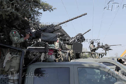 Mexican army patrols to curb extortion from criminal groups of lemon producers, in Paracuaro