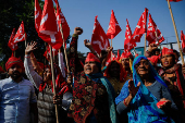 Farmers from the northern state of Uttar Pradesh shout slogans as they protest to demand better compensation for their land, in Noida