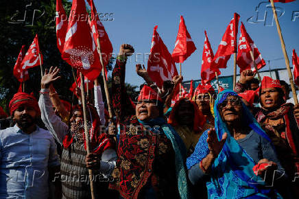 Farmers from the northern state of Uttar Pradesh shout slogans as they protest to demand better compensation for their land, in Noida