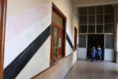 Students in a classroom after authorities announced the reopening of schools, in Damascus