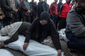 Palestinians mourn their dead at Deir Al Balah hospital after Israeli airstrike in central Gaza