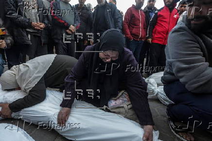 Palestinians mourn their dead at Deir Al Balah hospital after Israeli airstrike in central Gaza