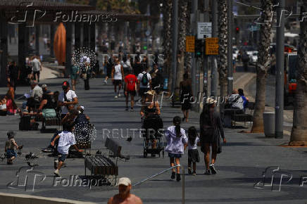 People walk in Tel Aviv,