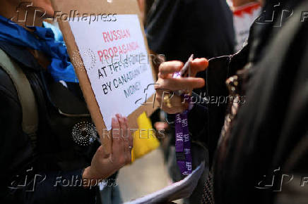 FILE PHOTO: Protesters gather outside the Toronto International Film Festival (TIFF) screening of 'Russians at War', in Toronto