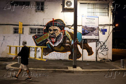 A new graffiti of of Hezbollah leader Sayyed Hassan Nasrallah, by Grafitiyul artists group following his elimination, in Tel Aviv