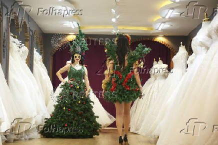 Models display Christmas and New Year-themed dresses at a wedding dress shop in Diyarbakir