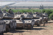 Israeli troops gather near the Gaza border, southern Israel