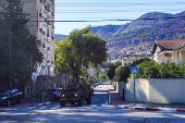 Israeli military vehicle drives in Kiryat Shmona