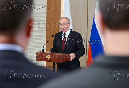 Russian President Putin attends a press conference in Astana