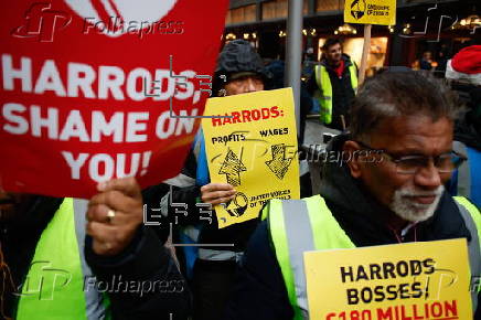 Harrods staff strike for Christmas bonus and better conditions.