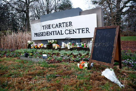 People pay tribute to former U.S. President Jimmy Carter who passed away at the age of 100