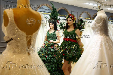 Models display Christmas and New Year-themed dresses at a wedding dress shop in Diyarbakir