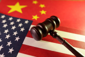 Illustration shows U.S. and Chinese flags and gavel