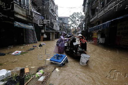 Red River overflows causing severe flooding in Hanoi following Typhoon Yagi