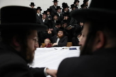 Ultra Orthodox Jews light Hanukkah holiday candles in Jerusalem