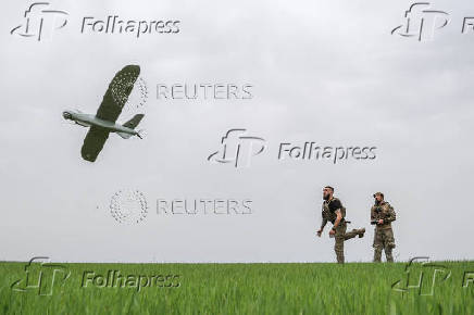 Ukrainian serviceman launch a reconnaissance UAV in a front line in Donetsk region
