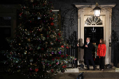 British Prime Minister Starmer and his wife switch on the Downing Street Christmas tree lights, in London