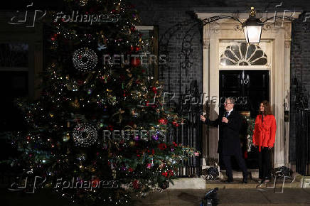 British Prime Minister Starmer and his wife switch on the Downing Street Christmas tree lights, in London