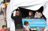 Displaced children who fled Aleppo countryside stand in Tabqa