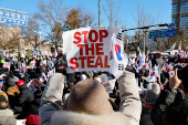 Impeached South Korean President Yoon Suk Yeol's supporters rally near the Corruption Investigation Office for High-ranking Officials, following his arrest, in Gwacheon