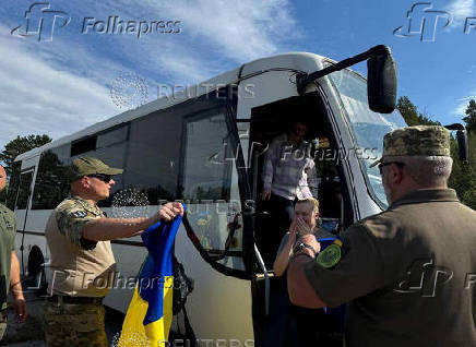 Ukrainian POWs are seen after a swap at an unknown location in Ukraine