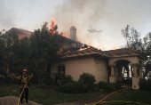 Smoke billows from the Mountain Fire, in California