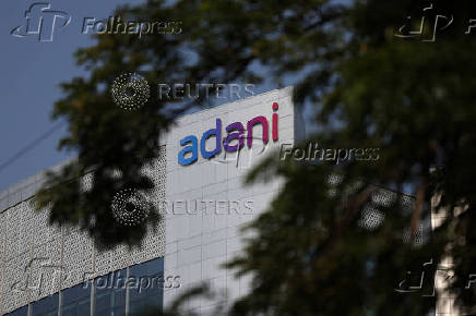 The logo of the Adani Group is seen on the facade of its Corporate House on the outskirts of Ahmedabad