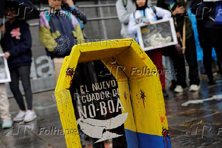 People gather to protest against the forced disappearance of four minors, in Quito