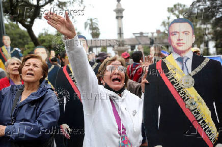 Supporters of Ecuador's President Daniel Noboa react as they listen to his speech in front of the Government Palace in Quito