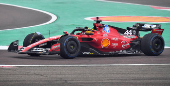 Lewis Hamilton drives a Ferrari F1 car around the Fiorano circuit as part of the TPC tests.