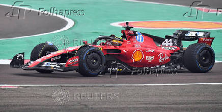 Lewis Hamilton drives a Ferrari F1 car around the Fiorano circuit as part of the TPC tests.