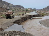 Truck drives on a road damaged by floods following heavy rains in the northwestern province of Hajjah