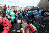 Pro-Palestinian activists clash with police during a protest against G7 meeting on Capri Island, in Naples