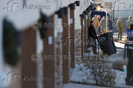 Investigators search a townhouse, in relation to the explosion in Las Vegas of a Tesla Cybertruck