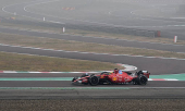 Lewis Hamilton drives a Ferrari F1 car around the Fiorano circuit as part of the TPC tests