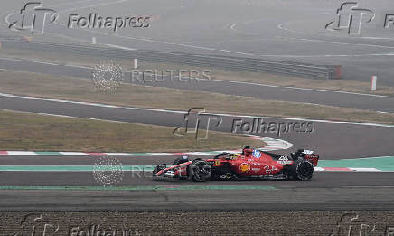 Lewis Hamilton drives a Ferrari F1 car around the Fiorano circuit as part of the TPC tests