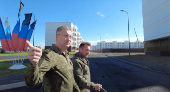 Russian Deputy Defence Minister Timur Ivanov inspects the construction of apartment blocks in Mariupol