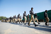 Members of police patrol to prevent an anti-government rally in Islamabad