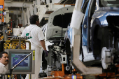 FILE PHOTO: An employee works on the production line of the Volkswagen Tiguan cars at the company's assembly plant in Puebla,