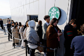 Starbucks opens new store in South Korea's border town, offering views of Korean village