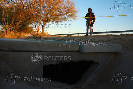 Authorities guard an illegal tunnel that crosses the border between Mexico and the United States