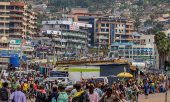 Pedestrians walk along a street in Kigali