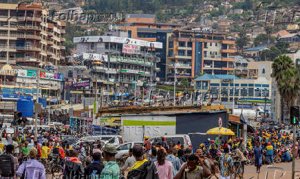 Pedestrians walk along a street in Kigali