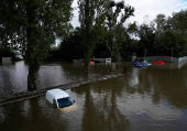 Stranded vehicles are seen at White Mills Marina after heavy rain and flooding in Northampton