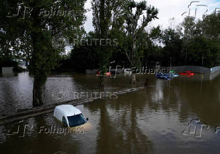 Stranded vehicles are seen at White Mills Marina after heavy rain and flooding in Northampton