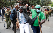 Kenyan activists and civil society representatives gather to deliver a list of people who disappeared during demonstrations against the government proposed tax hikes, in Nairobi