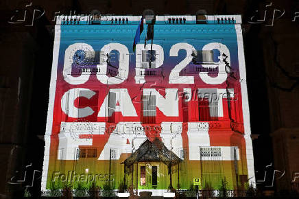 FILE PHOTO: Climate activists project a message onto the Embassy of Azerbaijan ahead of COP29 climate talks, in London