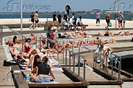 People relax on Melbourne St Kilda beach